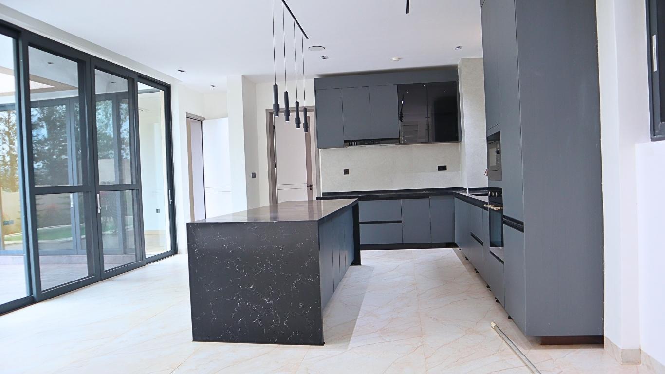 villa for sale in Rusororo Kigali, featuring premium cabinetry, high-end appliances, elegant finishes, and open-plan design – WePick Home+250794773349